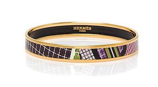 An Hermes Narrow Printed Enamel Bracelet, .05" wide, 2.5" diameter.