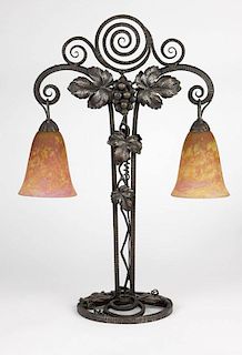 An Art Deco glass & wrought iron table lamp