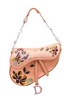 * A Christian Dior Peach Satin Embroidered Saddle Handbag,