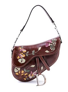 * A Christian Dior Brown Leather Saddle Handbag,
