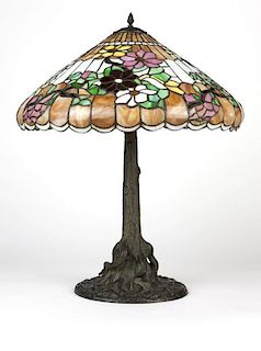 An American leaded glass & patinated metal table lamp