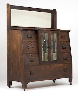 An English Arts and Crafts oak sideboard