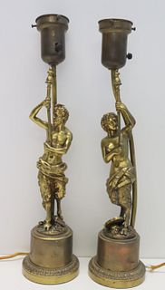 An Antique Pair Of Bronze Figural Lamps.