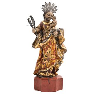 SAN JOSÉ CON EL NIÑO, MEXICO, 19TH CENTURY, Polychrome wood carving and silver foil glow, 13.3" (34 cm) in height