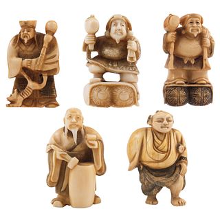 GROUP OF NETSUKE FIGURES JAPAN, EARLY 20TH CENTURY Carved in ivory with inked details Signed 1.9" (5 cm)