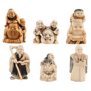 GROUP OF NETSUKE FIGURES JAPAN, EARLY 20TH CENTURY Carved in ivory Signed Includes Oriental characters 1.9" (5 cm)