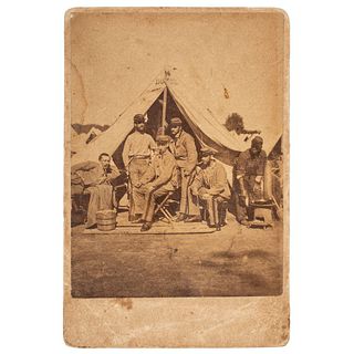 [CIVIL WAR]. Albumen photograph of Private George W. Spaulding, 13th New York State Militia, seated before tent "Hotel 16" with friends and African Am