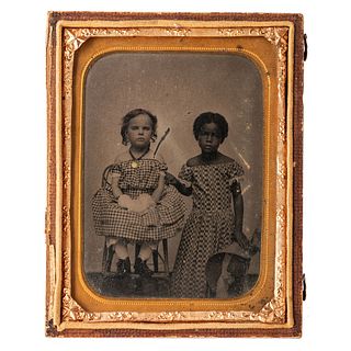 [TINTYPE - PORTRAITURE]. Quarter plate tintype of two young girls, one African American and one white.  