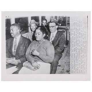 [KING, Martin Luther, Jr. (1929-1968)]. Press photograph of African American leaders riding integrated bus. Montgomery, AL, 21 December 1956. 