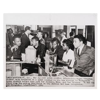 [CIVIL RIGHTS]. Press photograph of African American Freedom Riders having breakfast at a newly integrated bus station's lunch counter. Montgomery, AL