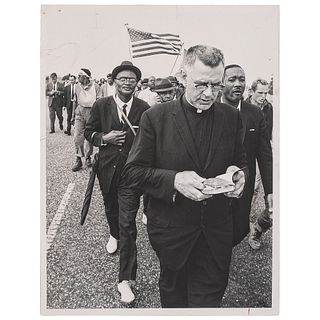 [CIVIL RIGHTS]. Press photograph of Rev. Edward Cassidy and African Americans participating in Selma to Montgomery march. Selma, AL, 25 May 1965. 