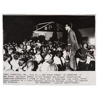 [BROWN, H. Rap (b. 1943)]. Press photograph of H. Rap Brown, SNCC Leader, addressing a crowd. Cambridge, MD, 25 July [1967]. 