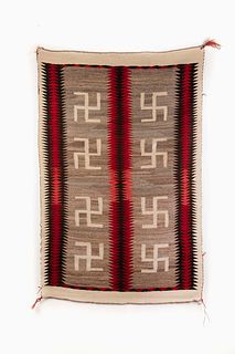 A Navajo Four Corners Whirling Log Saddle Blanket, ca. 1920