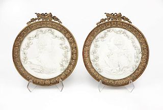 A pair of Sevres bisque porcelain relief plaques