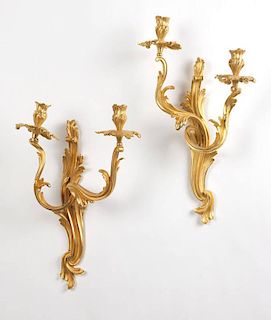 A pair of Louis XV style gilt bronze wall lights