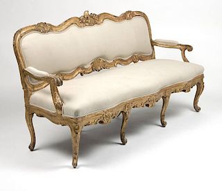 A Rococo style carved giltwood settee