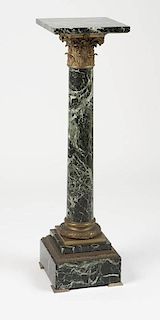 A gilt bronze-mounted marble pedestal
