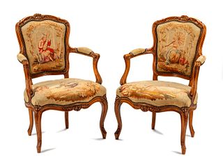 A Pair of Louis XV Tapestry-Upholstered Walnut Fauteuils