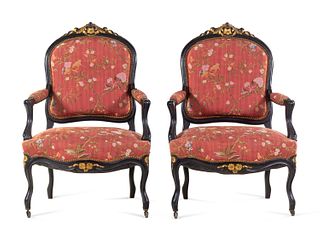 A Pair Louis XV Style Scalamandre Upholstered Parcel Gilt and Ebonized Fauteuils