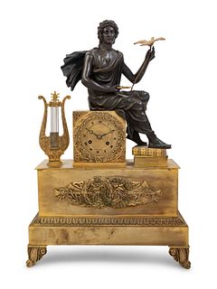 An Empire Style Gilt and Patinated Bronze Figural Mantel Clock