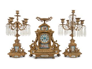 A Napoleon III Style Gilt Bronze and Sevres Style Porcelain Clock Garniture