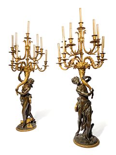 A Pair of Large Gilt and Patinated Bronze Figural Nine-Light Candelabra after the Models by Clodion