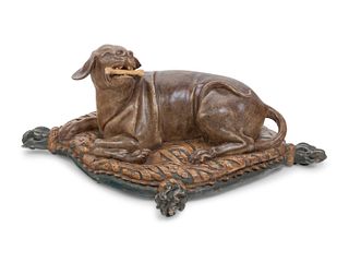 An Italian Carved and Painted Model of a Recumbent Dog