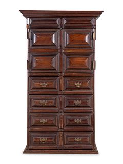 A Dutch Carved and Paneled Walnut Tall Chest of Drawers 