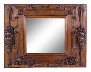 A Continental Carved Oak Mirror