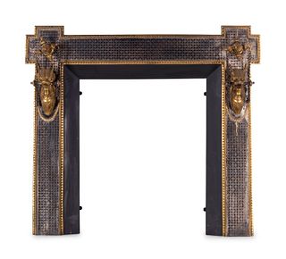 A Continental Silvered and Gilt Bronze Fireplace Surround
