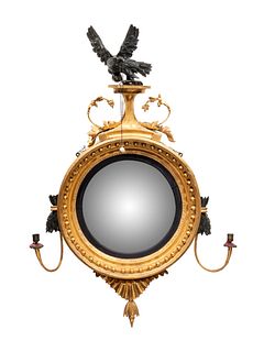 A Regency Parcel Ebonized Giltwood Girandole Mirror
