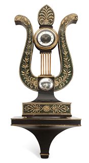 A Regency Ebonized and Parcel Gilt Eagle's Head Lyre-Form Bracket Clock