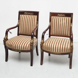 Near pair Empire style carved mahogany armchairs