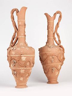 A pair of terracotta ewers
