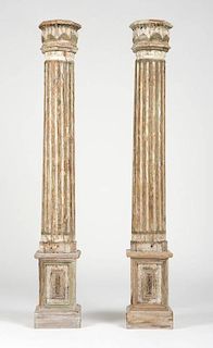 A pair of Continental carved & painted pine pillars