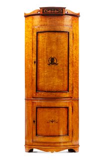An Italian Neoclassical Part Ebonized Birch Corner Cabinet