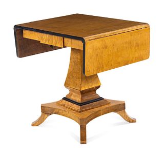 A Biedermeier Style Parcel Ebonized Satinwood Veneered Sofa Table