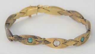 14 Karat Gold Bracelet, set with diamond and two emeralds, 15.7 grams.