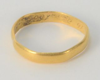 22 Karat Gold Band, dated 1852, bent, 4.1 grams.