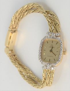 Omega 14 Karat Gold Ladies Wristwatch, with 14 Karat gold triple chain bracelet, total weight 20 grams.