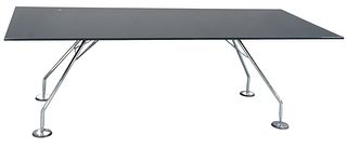 Lord Norman Foster "Tecno Nomos" dining table, having black glass top with chrome base, height 28 inches, top 39" x 86".