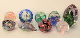 Group of Nine Art Glass Paperweights, one signed illegibly Carnival; two marked GES, one having pink swirls and one green; large floral paperweights m