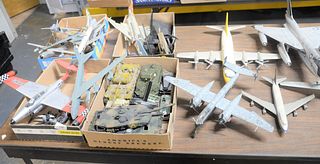 A Large Group of Model Airplanes and Tanks, to include a large fighter jet, a Lufthansa model, along with an Air California model.