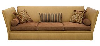 Edward Ferrell Sofa, having Knole drop ends with tassels (not currently fully assembled), upholstered in tan ostrich skin, with brown upholstered cush