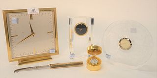 Five Piece Group, to include Movado crystal clock; square Baltman brass and glass 8-day clock; Hoya glass clock; brass Hamilton vanity clock, height 7