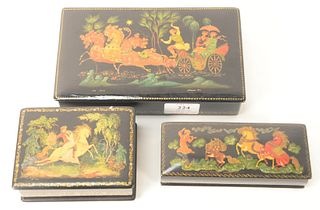 Three Russian Lacquer Boxes, having legends and fairy tale motif, manner of Palekh School, one with horses and carriage, marked 1874, one having gallo
