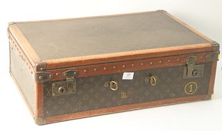 Vintage Louis Vuitton Suitcase, with LV monogram decoration, bought from Saks Fifth Avenue, #809038, height 16 1/2 inches, width 25 3/4 inches.