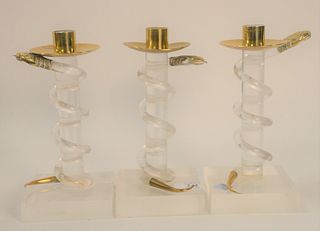 Three Alessandro Albrizzi Candlesticks, Lucite with snake motif, 20th Century; height 8 inches. Provenance: The Estate of Gloria Schiff, 630 Park Aven
