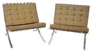 Pair of Barcelona Chairs, vintage, distressed leather, very heavy, height 29 inches.