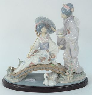 Large Lladro Porcelain Figure, of two Japanese women, on small bridet with a swan, signed, dated 4-28-85, and marked to the underside, height 11 inche